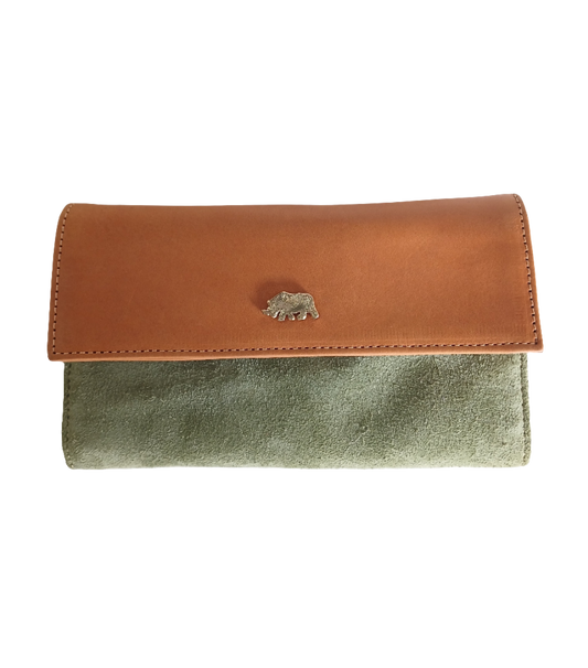 Green and tan leather purse with rhino