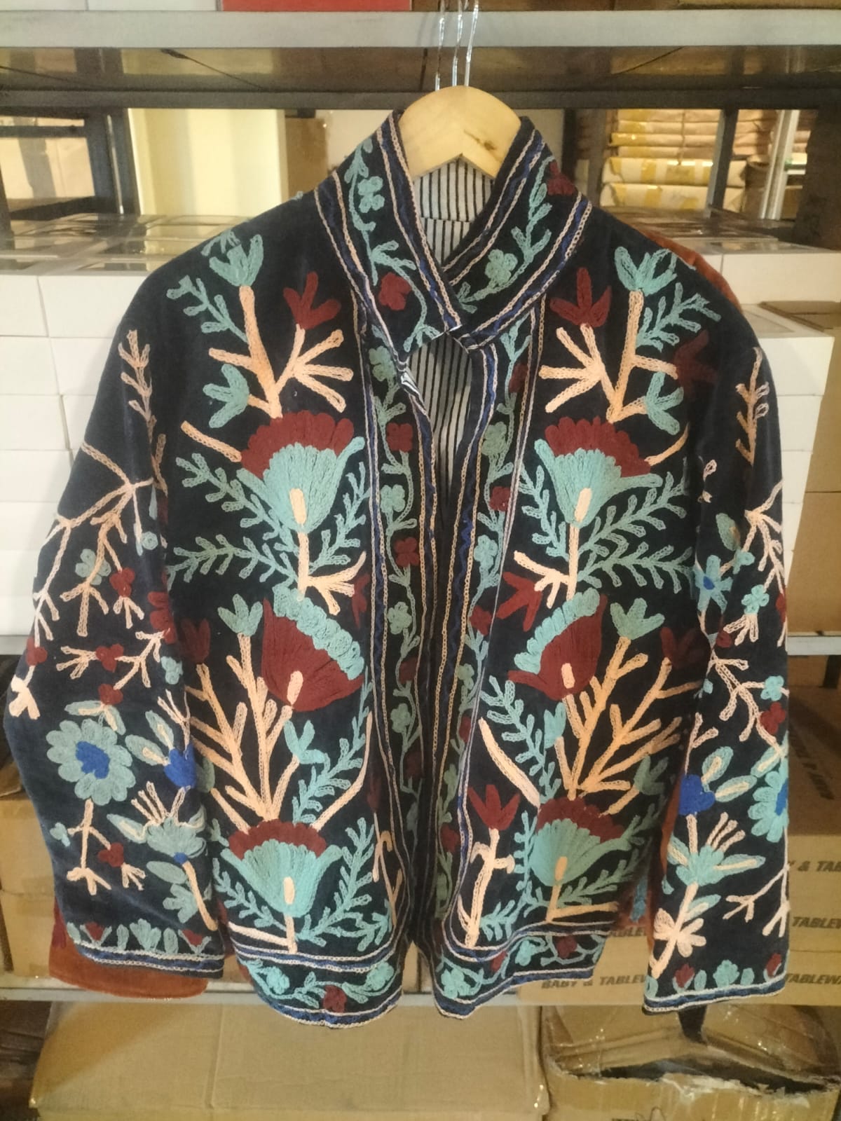 Navy blue jacket with red and blue flowers