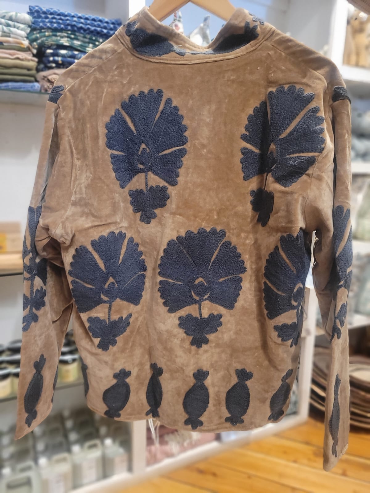 Beige jacket with blue floral pattern