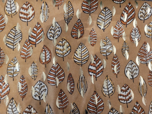 Brown scarf with intricate leaf pattern design