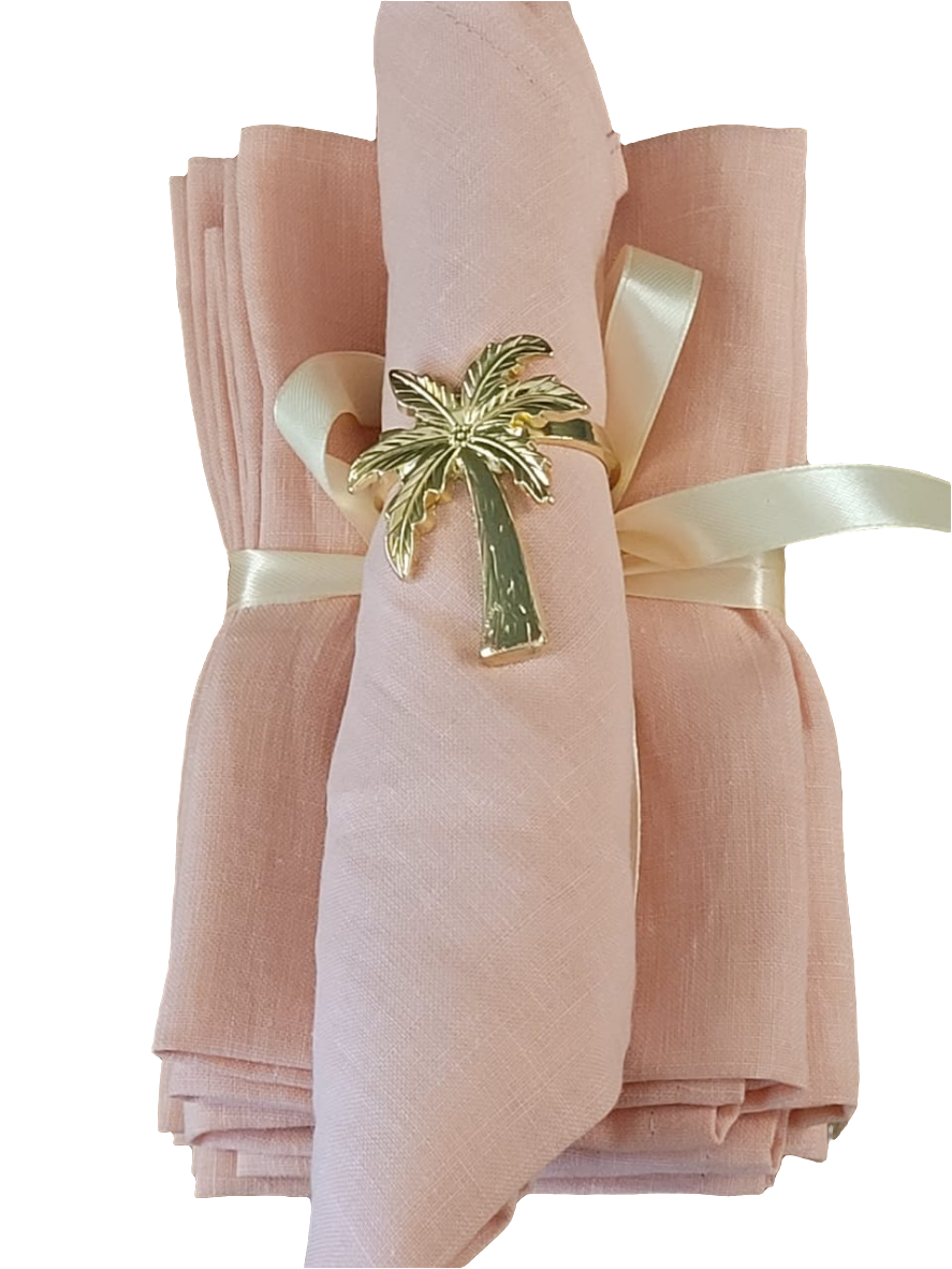 Stack of folded French linen napkins in natural tones