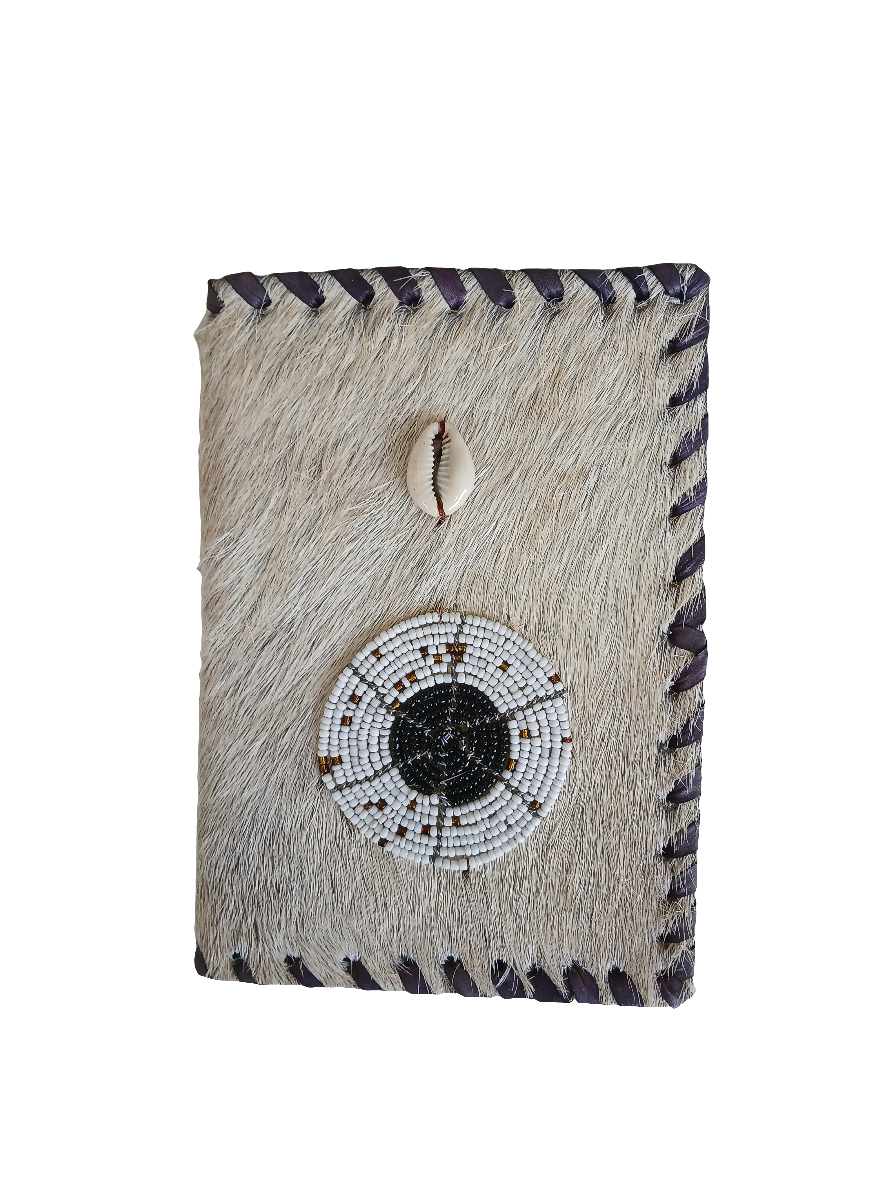 A6 notebook bound in spotted cowhide with leather trim