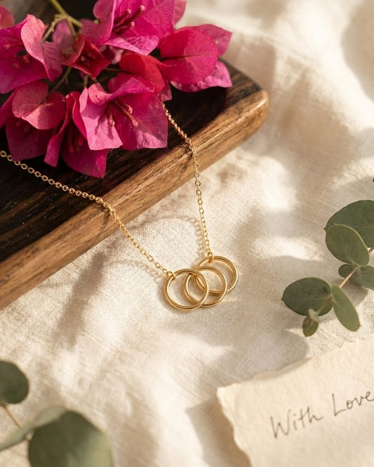 Br Three circle karma knot necklace