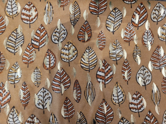 Brown scarf with intricate leaf pattern design